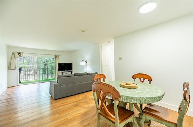 1108 Camino Real Unit 306, Redondo Beach, CA 90277 - dining space with light wood-style floors and baseboards