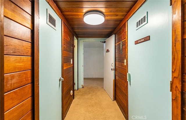 1108 Camino Real Unit 306, Redondo Beach, CA 90277 - hall featuring wooden ceiling, wooden walls, and light carpet