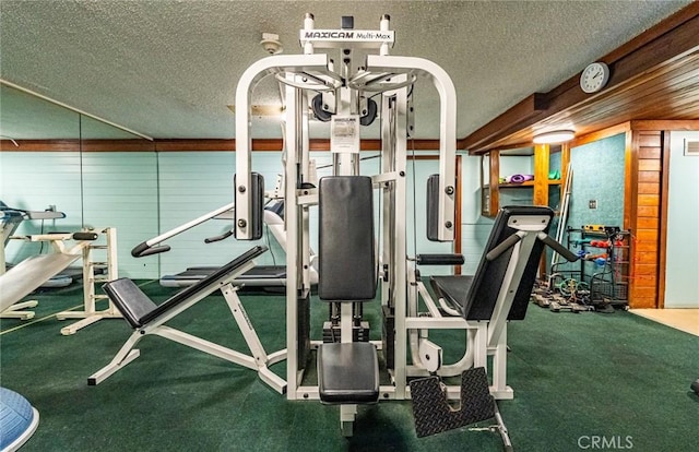 1108 Camino Real Unit 306, Redondo Beach, CA 90277 - gym featuring a textured ceiling and wooden walls