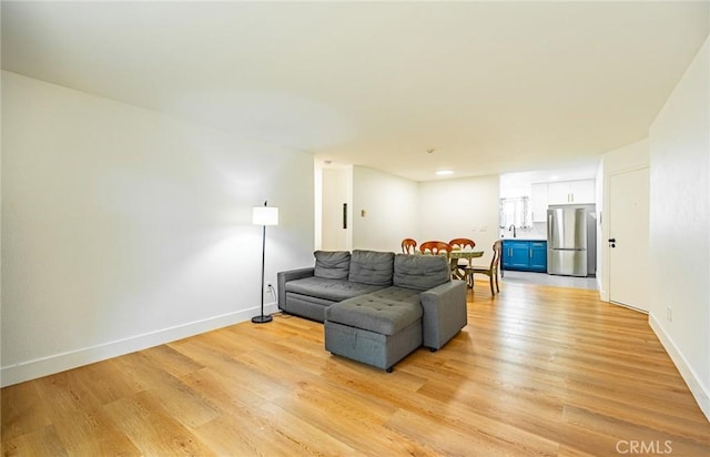 1108 Camino Real Unit 306, Redondo Beach, CA 90277 - living room with light wood finished floors and baseboards
