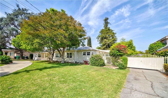 ranch-style home with a gate