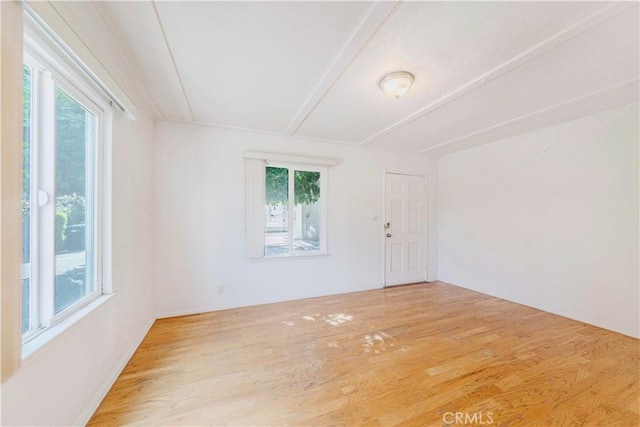 empty room with wood finished floors