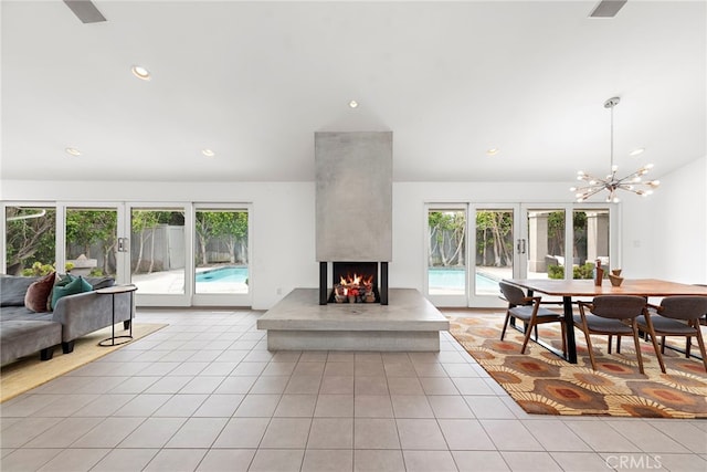 1601 Kent Ln, Newport Beach, CA 92660 - living area featuring healthy amount of natural light, light tile patterned flooring, a multi sided fireplace, a chandelier, and recessed lighting
