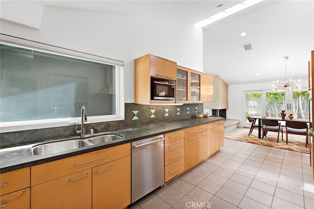 1601 Kent Ln, Newport Beach, CA 92660 - kitchen with stainless steel dishwasher, a sink, built in microwave, light tile patterned floors, and tasteful backsplash