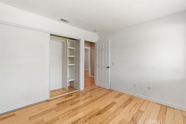 168 Radford Ct, Riverside, CA 92507 - unfurnished bedroom featuring wood finished floors and a closet