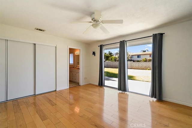 168 Radford Ct, Riverside, CA 92507 - unfurnished bedroom featuring access to exterior, light wood-style flooring, baseboards, and a closet