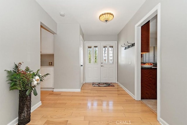 168 Radford Ct, Riverside, CA 92507 - foyer with light wood-style floors and baseboards