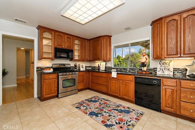168 Radford Ct, Riverside, CA 92507 - kitchen with black appliances, a sink, brown cabinets, glass insert cabinets, and light tile patterned floors