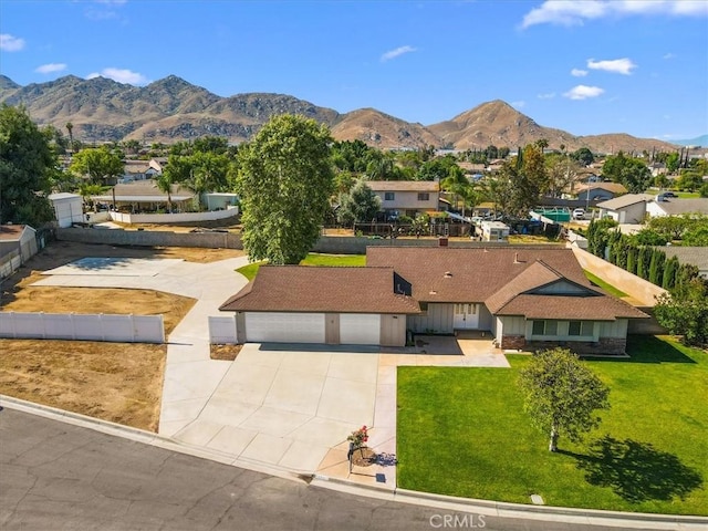 168 Radford Ct, Riverside, CA 92507 - view of front of home with a mountain view, driveway, and a residential view