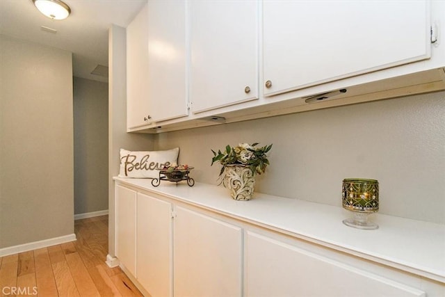 168 Radford Ct, Riverside, CA 92507 - bar area featuring baseboards and light wood-type flooring