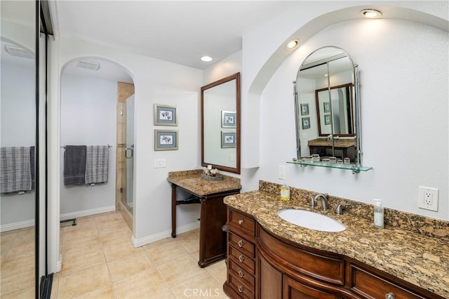 16422 Harbour Ln Unit 17, Huntington Beach, CA 92649 - bathroom with a shower stall, baseboards, tile patterned floors, two vanities, and recessed lighting