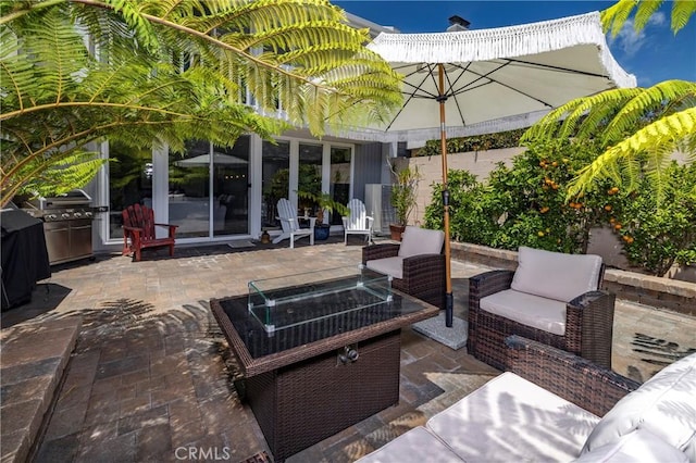 16422 Harbour Ln Unit 17, Huntington Beach, CA 92649 - view of patio with an outdoor living space with a fire pit and a grill