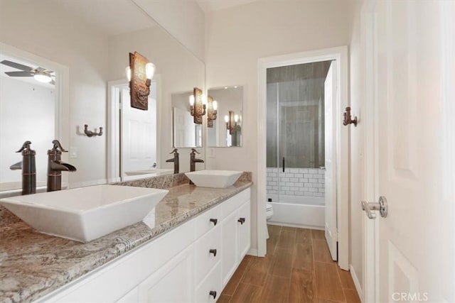 27086 Maple Tree Ct, Valencia, CA 91381 - full bath with toilet, a chandelier, ceiling fan, double vanity, and wood finished floors