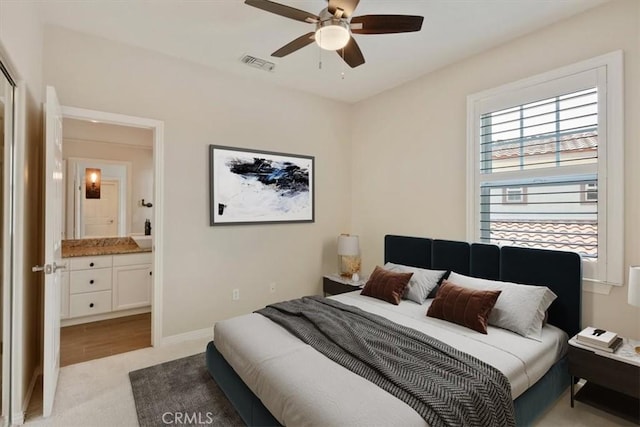 27086 Maple Tree Ct, Valencia, CA 91381 - bedroom featuring light colored carpet, ensuite bath, ceiling fan, and baseboards