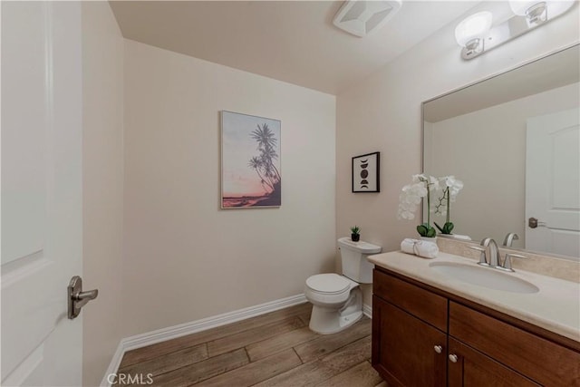 28220 Highridge Rd Unit 104, Rancho Palos Verdes, CA 90275 - half bath with wood finished floors, vanity, toilet, and baseboards