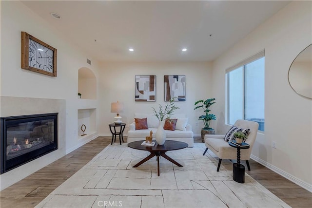 28220 Highridge Rd Unit 104, Rancho Palos Verdes, CA 90275 - living area with wood finished floors, recessed lighting, built in shelves, baseboards, and a glass covered fireplace