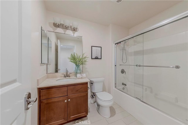 28220 Highridge Rd Unit 104, Rancho Palos Verdes, CA 90275 - bathroom featuring toilet, vanity, tile patterned flooring, and bath / shower combo with glass door