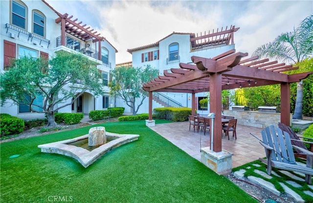 28220 Highridge Rd Unit 104, Rancho Palos Verdes, CA 90275 - surrounding community featuring exterior kitchen, a patio, a pergola, and a lawn
