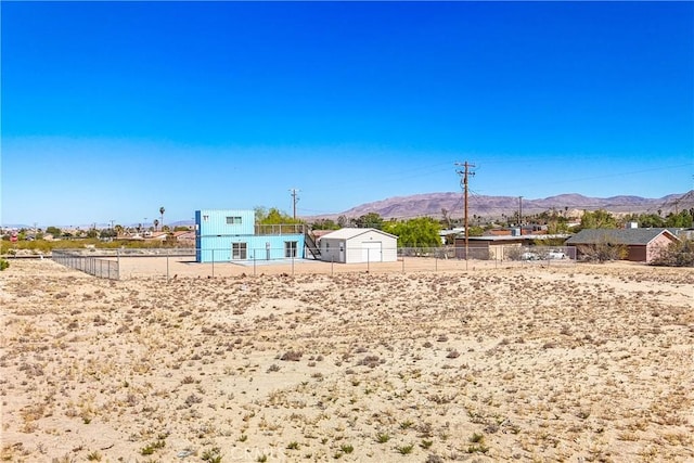72473 Desert Trail Dr Unit 29, Palms, CA 92277 - view of yard with a mountain view and fence