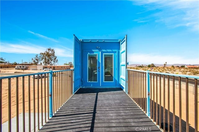 72473 Desert Trail Dr Unit 29, Palms, CA 92277 - balcony with french doors and a deck with mountain view