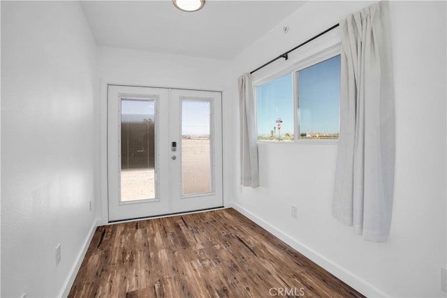 72473 Desert Trail Dr Unit 29, Palms, CA 92277 - entryway featuring french doors, baseboards, and dark wood-style flooring