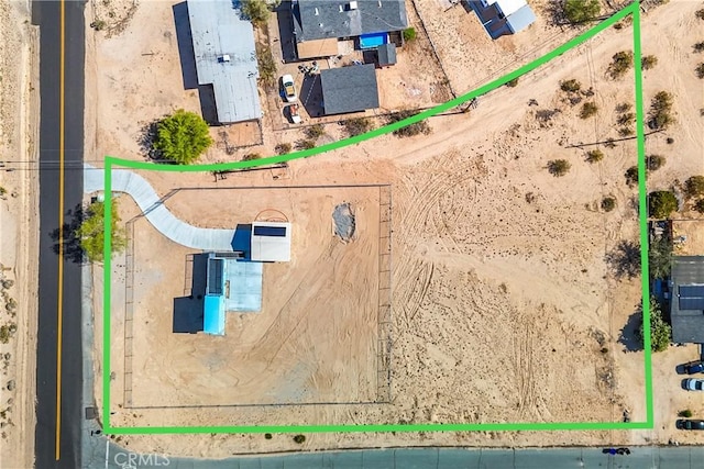 72473 Desert Trail Dr Unit 29, Palms, CA 92277 - aerial view of property's location with property parcel outlined and a desert landscape