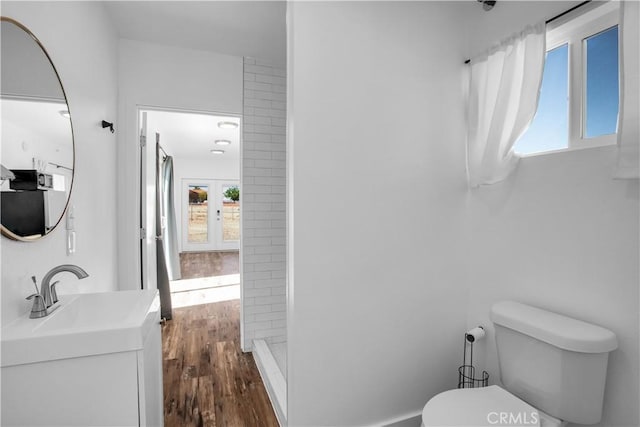 72473 Desert Trail Dr Unit 29, Palms, CA 92277 - full bath featuring toilet, wood finished floors, walk in shower, and vanity