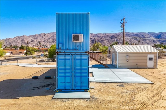 72473 Desert Trail Dr Unit 29, Palms, CA 92277 - view of outdoor structure featuring a mountain view and fence