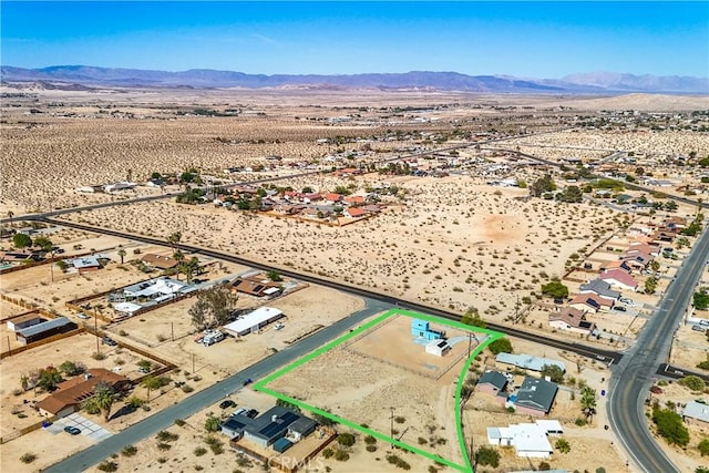 72473 Desert Trail Dr Unit 29, Palms, CA 92277 - aerial view of sparsely populated area featuring a desert landscape, a mountain backdrop, and property parcel outlined