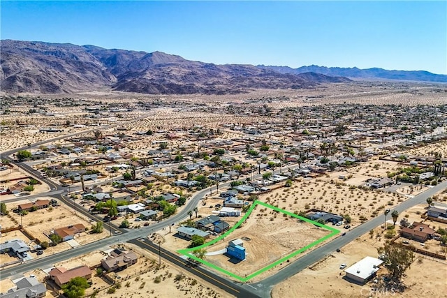 72473 Desert Trail Dr Unit 29, Palms, CA 92277 - aerial view of property's location with mountains, property boundaries highlighted, and a desert landscape