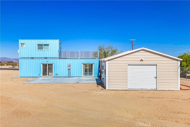 72473 Desert Trail Dr Unit 29, Palms, CA 92277 - view of front of property with board and batten siding and an outbuilding