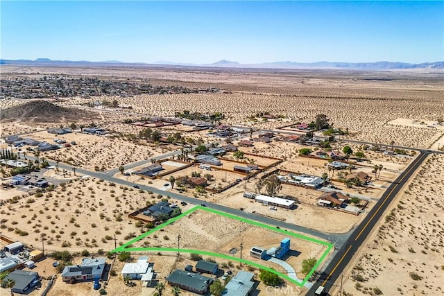 72473 Desert Trail Dr Unit 29, Palms, CA 92277 - aerial view of sparsely populated area featuring a desert landscape, property boundaries highlighted, and mountains