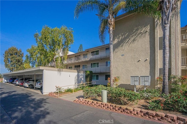 3365 Punta Alta Unit 3C, Laguna Woods, CA 92637 - view of property with covered parking