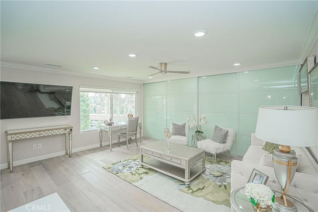 3365 Punta Alta Unit 3C, Laguna Woods, CA 92637 - living area featuring crown molding, a ceiling fan, wood finished floors, baseboards, and recessed lighting