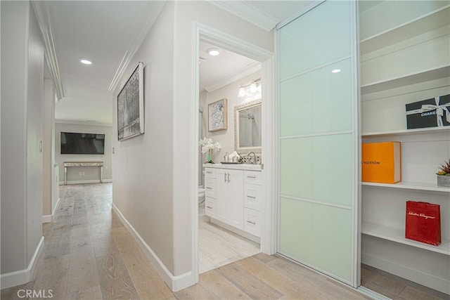 3365 Punta Alta Unit 3C, Laguna Woods, CA 92637 - hall with light wood-type flooring, crown molding, and recessed lighting