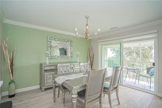 3365 Punta Alta Unit 3C, Laguna Woods, CA 92637 - dining space featuring a chandelier, ornamental molding, baseboards, and light wood-style floors