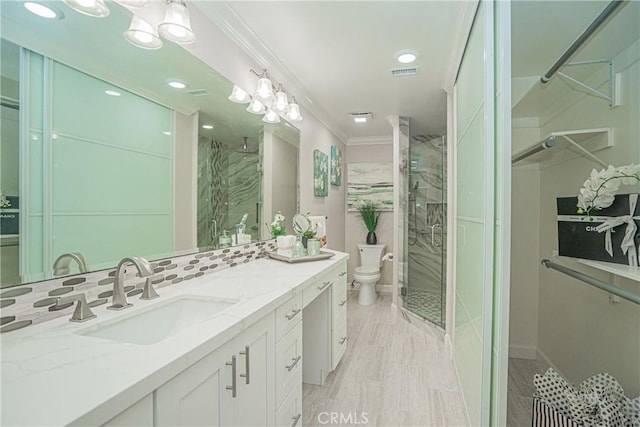3365 Punta Alta Unit 3C, Laguna Woods, CA 92637 - full bathroom with a stall shower, crown molding, vanity, toilet, and recessed lighting