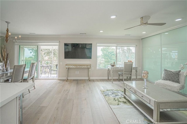 3365 Punta Alta Unit 3C, Laguna Woods, CA 92637 - living room with crown molding, light wood-type flooring, baseboards, a chandelier, and ceiling fan