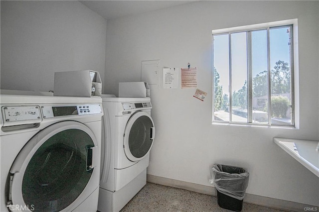 3365 Punta Alta Unit 3C, Laguna Woods, CA 92637 - washroom with washer and dryer and baseboards