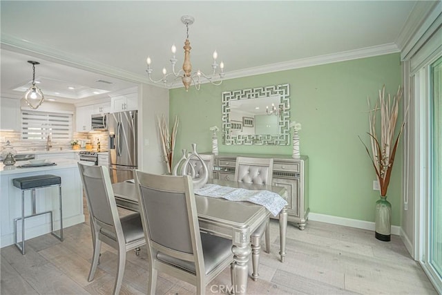 3365 Punta Alta Unit 3C, Laguna Woods, CA 92637 - dining area featuring a chandelier, crown molding, light wood finished floors, recessed lighting, and baseboards