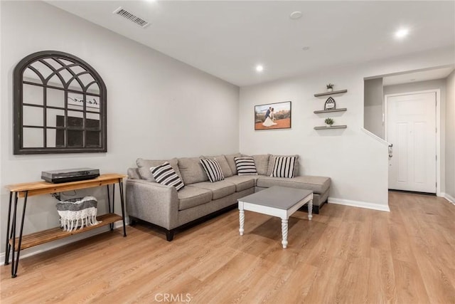 16073 Narni Ln, Fontana, CA 92336 - living area featuring light wood-style floors, baseboards, and recessed lighting