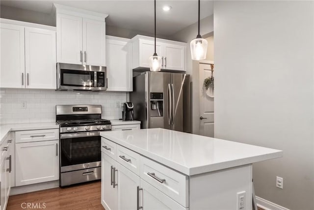 16073 Narni Ln, Fontana, CA 92336 - kitchen with appliances with stainless steel finishes, tasteful backsplash, white cabinets, and recessed lighting