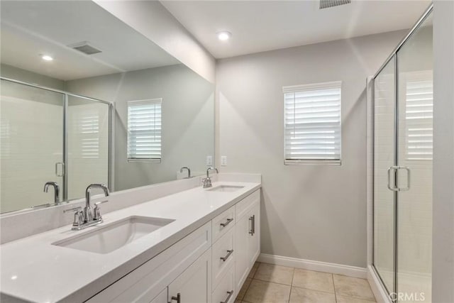 16073 Narni Ln, Fontana, CA 92336 - full bath with double vanity, tile patterned floors, baseboards, a stall shower, and recessed lighting