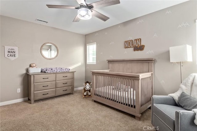 16073 Narni Ln, Fontana, CA 92336 - carpeted bedroom with baseboards, a ceiling fan, and a crib