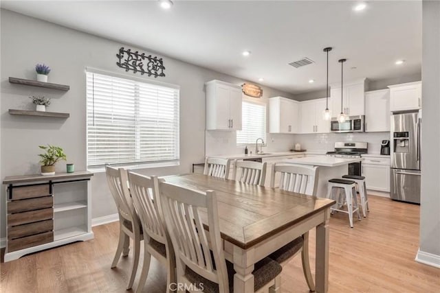 16073 Narni Ln, Fontana, CA 92336 - dining space with recessed lighting, light wood finished floors, and baseboards