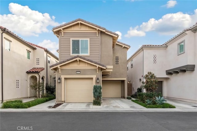 16073 Narni Ln, Fontana, CA 92336 - view of front of property featuring a garage, stucco siding, concrete driveway, and a tiled roof