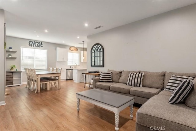 16073 Narni Ln, Fontana, CA 92336 - living area with light wood finished floors and recessed lighting