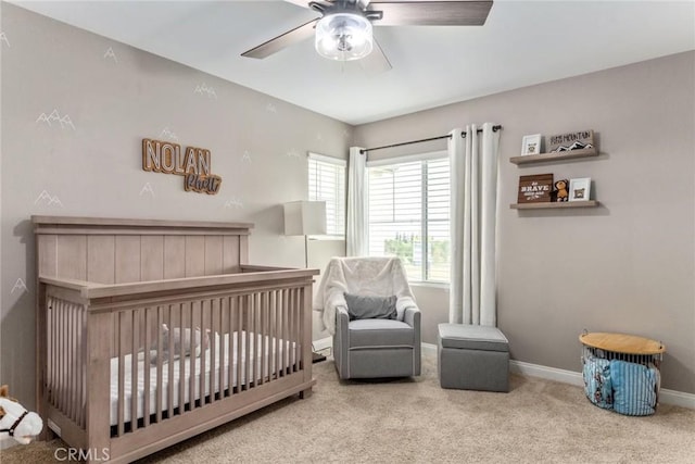 16073 Narni Ln, Fontana, CA 92336 - carpeted bedroom featuring a crib, baseboards, and ceiling fan
