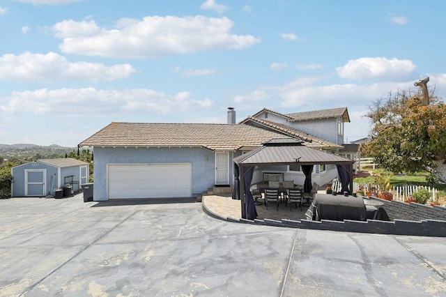 3631 Alta Vista Dr, Fallbrook, CA 92028 - ranch-style house featuring a shed, a garage, an outbuilding, a gazebo, and stucco siding