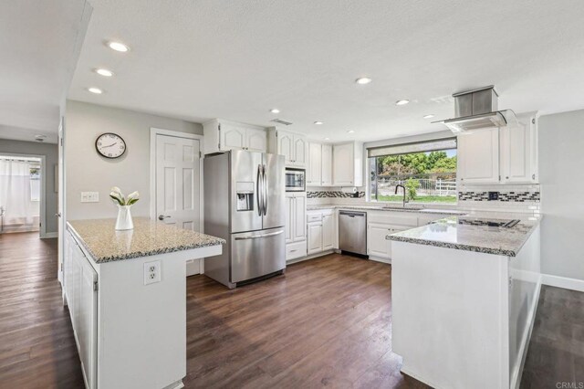 3631 Alta Vista Dr, Fallbrook, CA 92028 - kitchen featuring stainless steel appliances, a peninsula, white cabinetry, backsplash, and recessed lighting